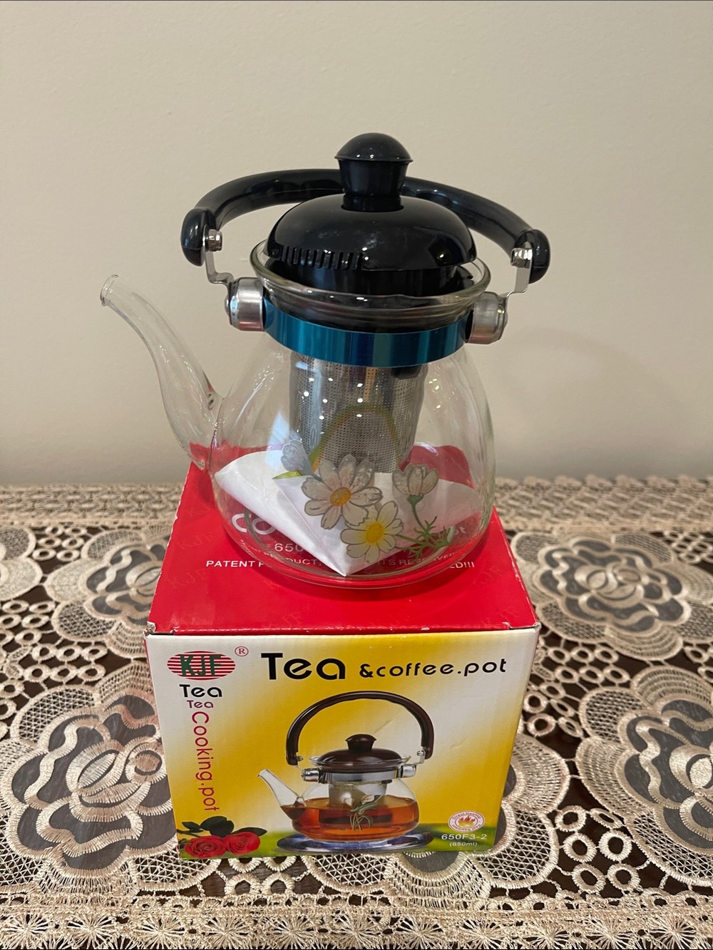Glass Teapot with Floral Design and Black Handle